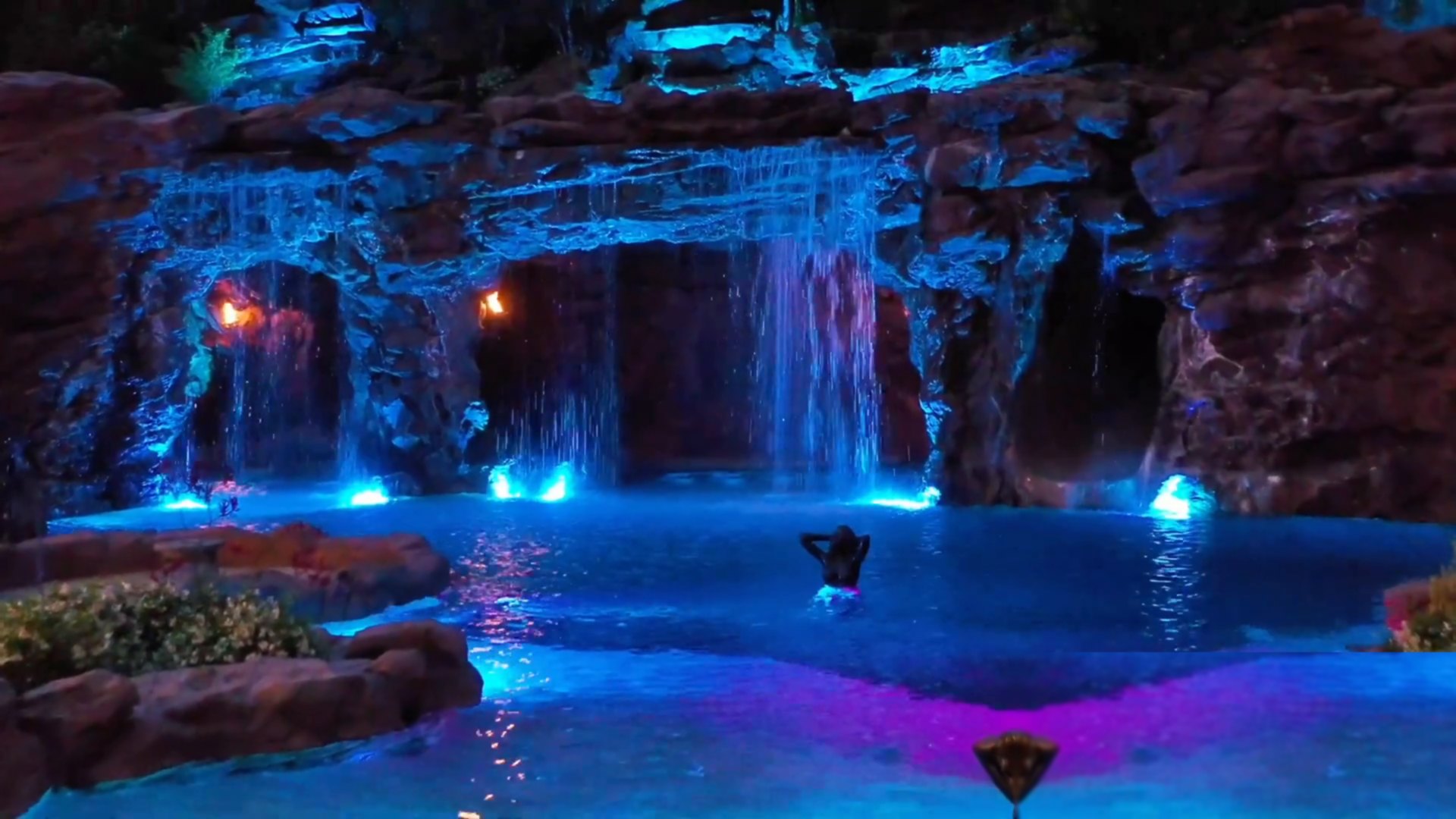 Aerial view of the custom pool, grotto and waterfalls at Drake's YOLO Estate, built by Ultimate Water Creations