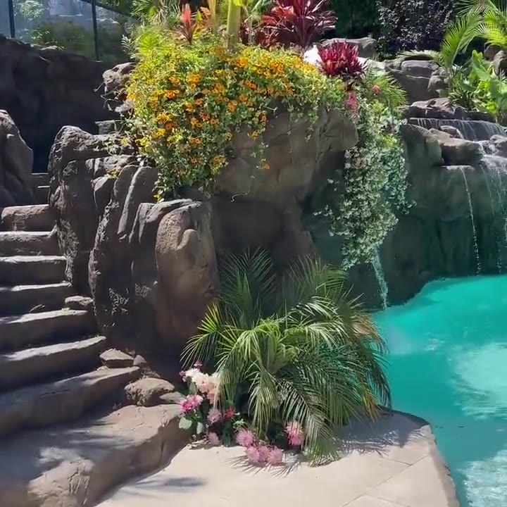 Multi-level pool remodel with tiered pools and rockwork waterfalls built for Meghan Trainor